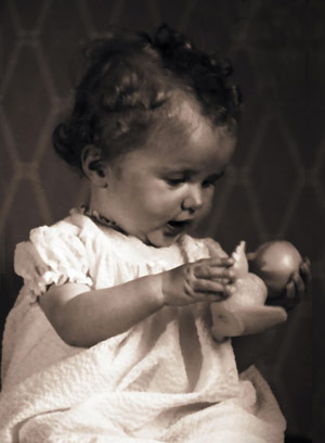 Baby playing with a duck toy