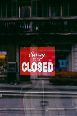 clothing store with a closed sign on the door