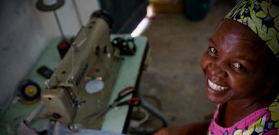 Woman seated at a sewing machine