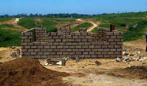 An unfinished cement block house